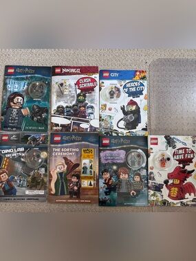 A Bundle of 7 LEGO Activity Book, each with Minifigures
